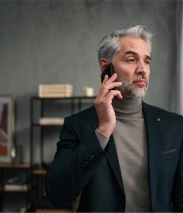 mature-businessman-making-a-phone-call-indoors-in-2022-01-19-01-06-56-utc.jpg